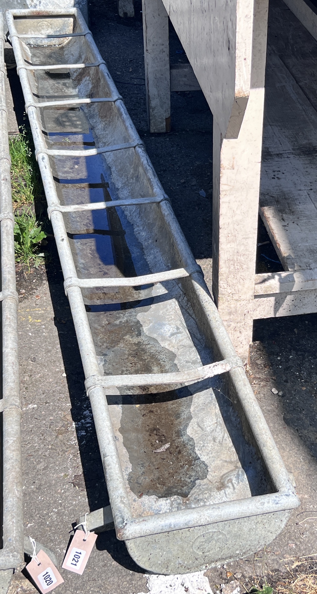 A galvanised feeding trough, length 247cm, depth 28cm, height 20cm